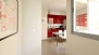Sevilla Apartamento - A corridor leads to the kitchen.