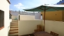Sevilla Apartamento - There is a seating area on the lower terrace level.