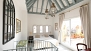 Sevilla Apartamento - Bedroom on the upper floor. Sliding doors open to the private terrace.