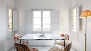 Seville Apartment - Dining area with table and chairs.