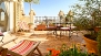 Sevilla Apartamento - Table with chairs on the terrace.