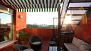 Seville Apartment - Lower terrace with garden furniture and a canopy.