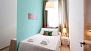 Sevilla Apartamento - Bedroom 2 has a double bed and a wardrobe with mirrored doors.