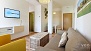 Seville Apartment - View towards the dining space (beyond the pillar).