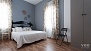 Sevilla Apartamento - Bedroom 3 with a double bed (1.50 x 2.00 m) and a wardrobe.