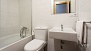 Seville Apartment - Main bathroom with a bathtub.
