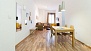 Seville Apartment - Dining space with table and chairs.