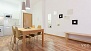 Séville Appartement - Beyond the dining area is the kitchen.