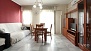 Seville Apartment - Living room with sofa, dining table and chairs.