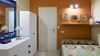 Seville Apartment - Bedroom. The door opens to the bathroom.