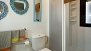 Seville Apartment - Bathroom with washbasin, w.c. and shower.