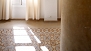 Seville Apartment - Traditional floor tiles and marble columns.
