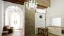 Séville Appartement - Features include exposed brick walls, traditional floor tiles, marble columns and high ceilings.