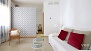 Sevilla Apartamento - Beyond the living room, and partially separated by a large wardrobe, is the bedroom.
