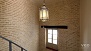 Sevilla Apartamento - The house combines modern elements with traditional features such as exposed brick walls.