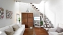 Seville Apartment - Living room with sofa, coffee table and TV.