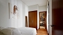 Sevilla Apartamento - Bedroom 2 with a double bed, fitted wardrobe and en-suite bathroom.