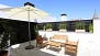 Sevilla Apartamento - Terrace with outdoor seating and parasol.