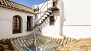 Séville Appartement - View of the stairs leading to the roof terrace.