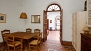 Seville Apartment - The dining-room, with the patio beyond.