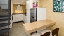 Séville Appartement - Kitchen with a breakfast bar and bar stools.