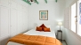 Sevilla Apartamento - Bedroom No. 3 has two joined single beds and a fitted wardrobe.