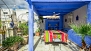 Seville Apartment - Pergola with a dining table.