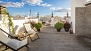 Sevilla Ferienwohnung - Terrace No.2 (shared). With deckchairs, parasol, plants and an outdoor shower.