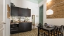 Seville Apartment - Beyond the dining area is the kitchen.