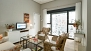 Seville Apartment - Living room. A large window faces the interior building courtyard.