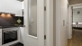 Séville Appartement - A corridor leads to the 2 bedrooms and 2 bathrooms.