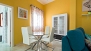 Seville Apartment - Dining table with four chairs.