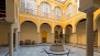 Seville Apartment - The house has a majestic central patio decorated with ceramic tiles and a colonnade of arches.