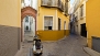 Sevilla Apartamento - The gate opens to a passageway which leads to the building.
