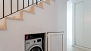 Seville Apartment - The washing machine is hidden away below the stairs.
