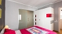 Séville Appartement - Bedroom with double bed, wardrobe and en-suite bathroom.