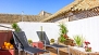 Seville Apartment - Terrace with 2 deck chairs.