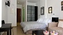 Sevilla Apartamento - The sleeping area has twin beds placed together and a large wardrobe.