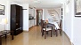 Seville Apartment - Dining table with chairs. The circular stairs lead up to the 2 bedrooms